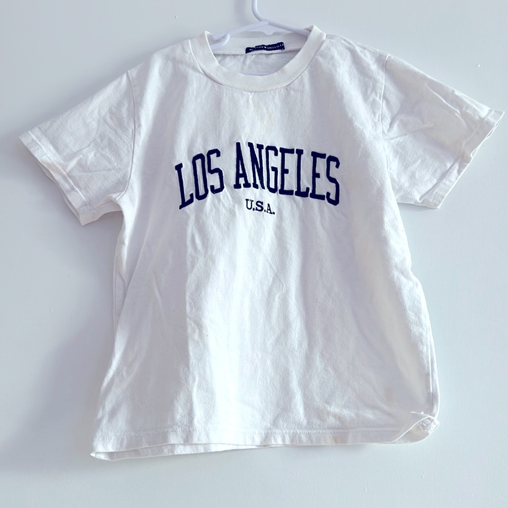 This is white brandy Millville shirt it is kind of cropped.